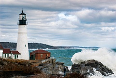 Large Wave Breaks by Portland Head Lighthouse in Maine